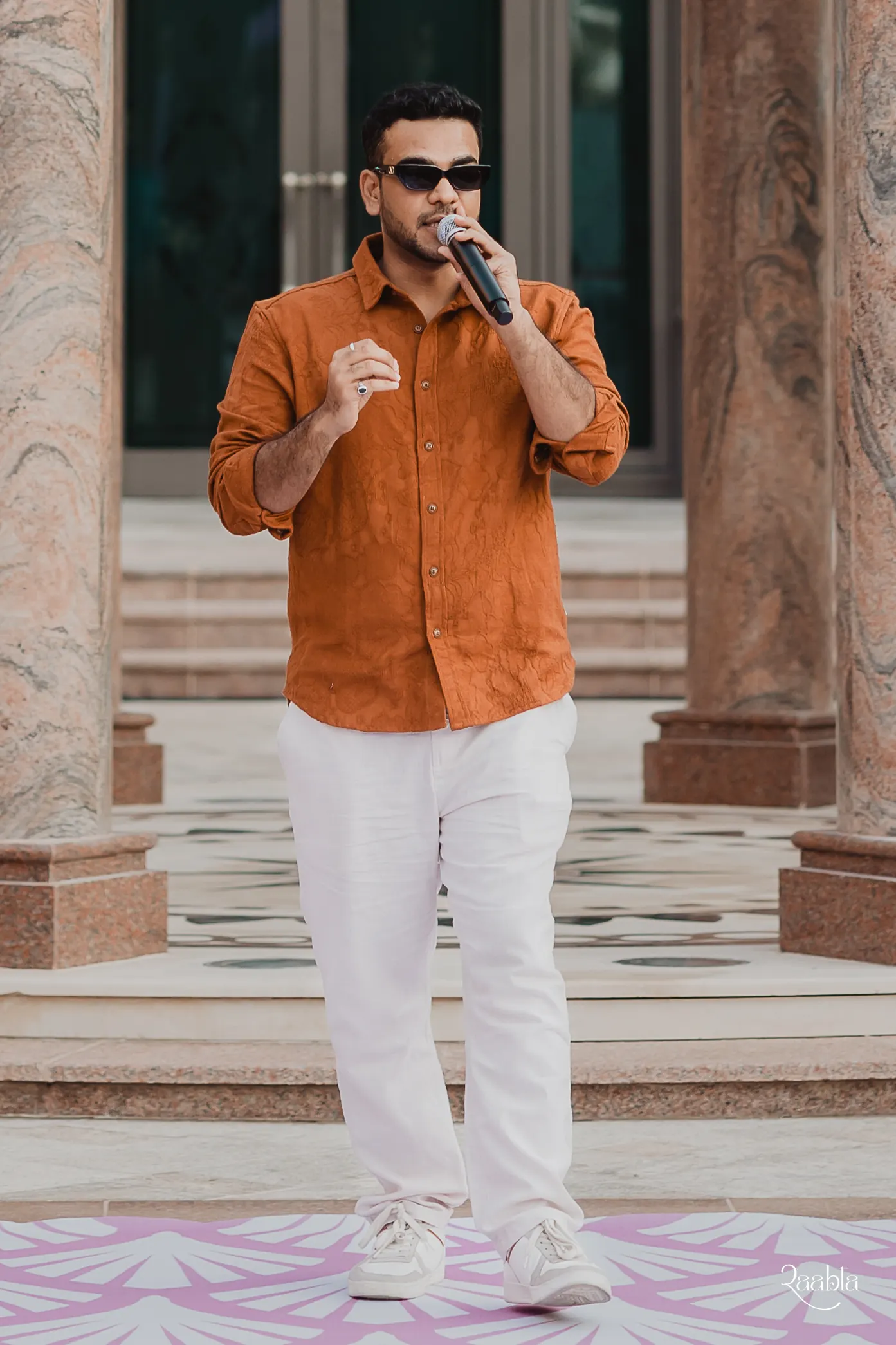 Chirag Vithalani with a microphone at Emirates Palace, Abu Dhabi