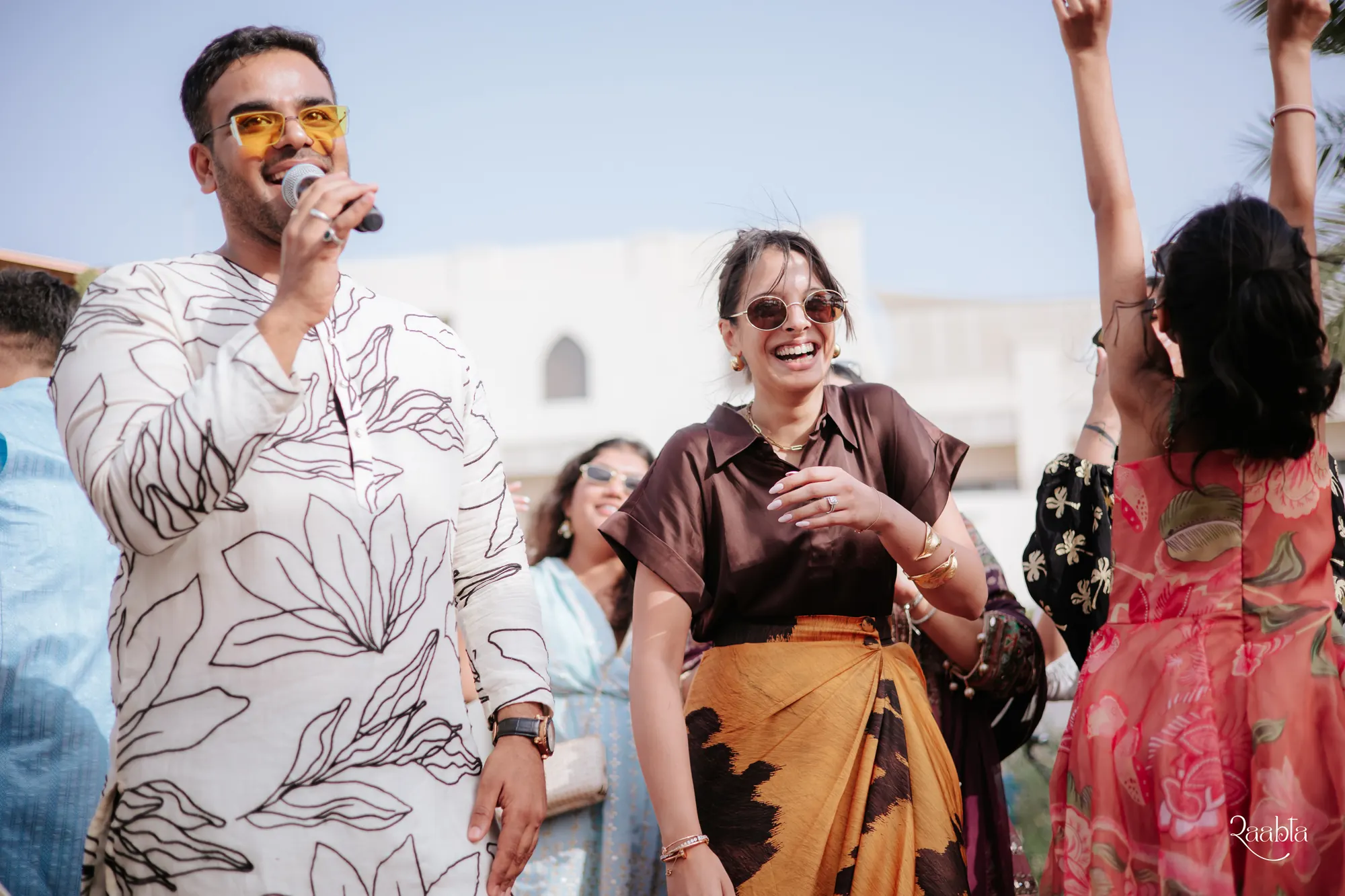 Chirag Vithalani with the mic among guests at Shiven and Palak's wedding, Bahrain