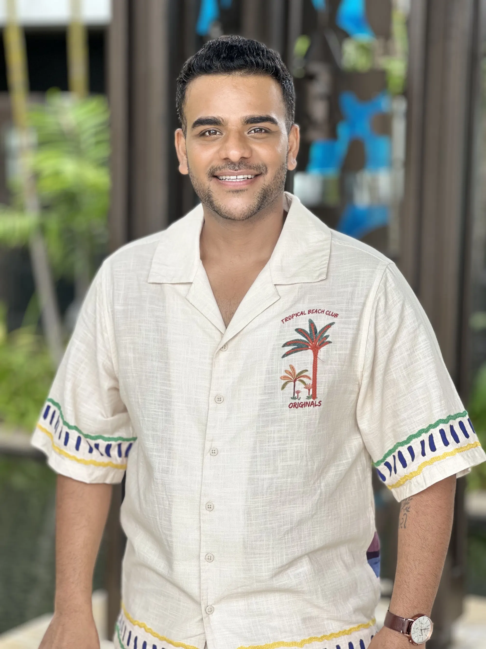 Close portrait of Chirag Vithalani smiling in an embroidered shirt