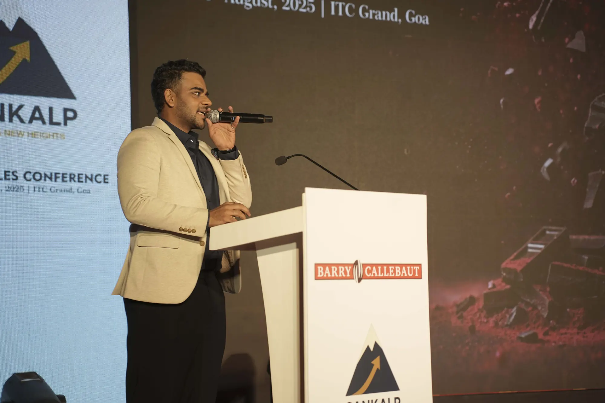 Chirag Vithalani hosting Barry Callebaut's Sankalp annual sales conference from the podium