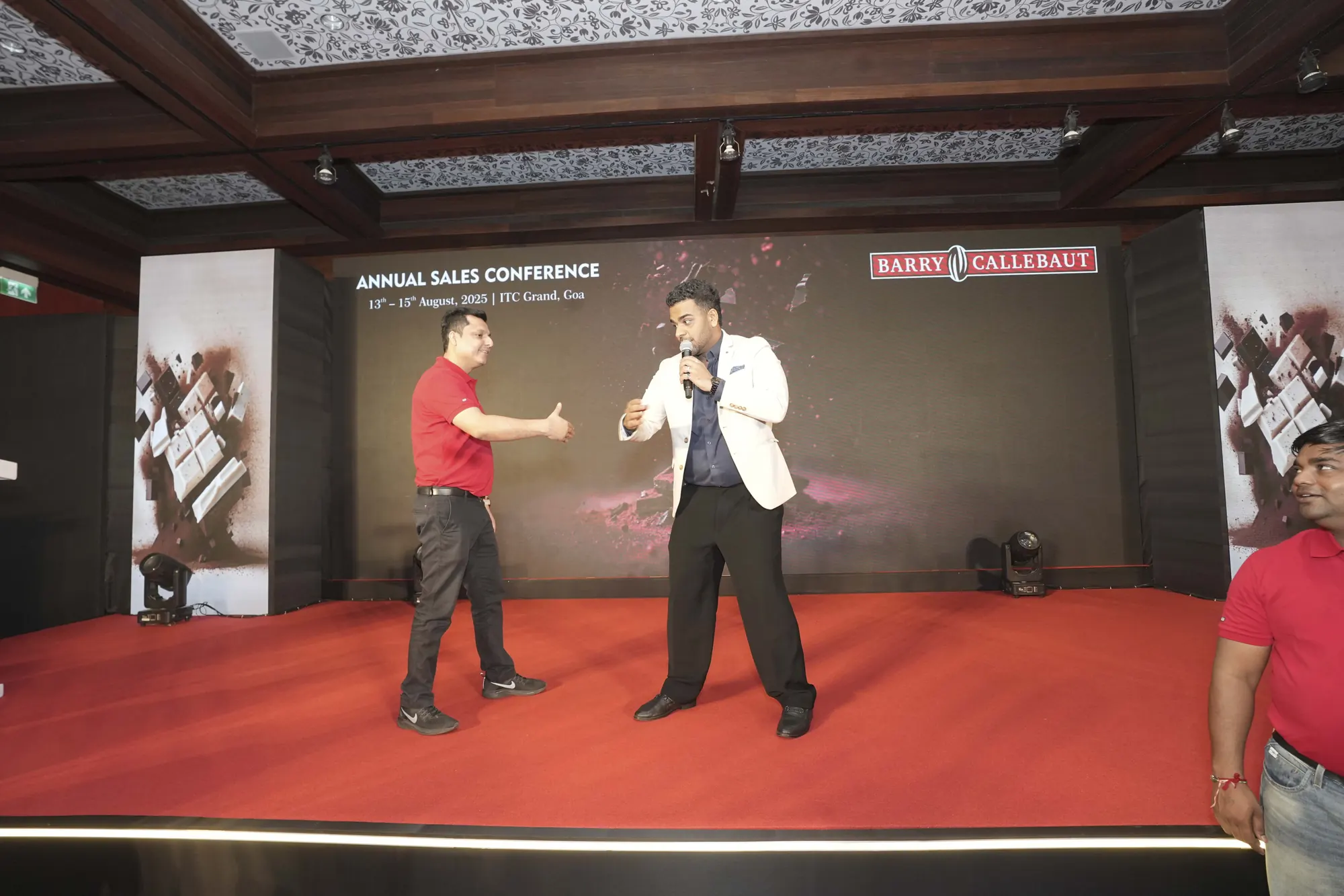 Chirag Vithalani on stage with a delegate at Barry Callebaut's Sankalp conference