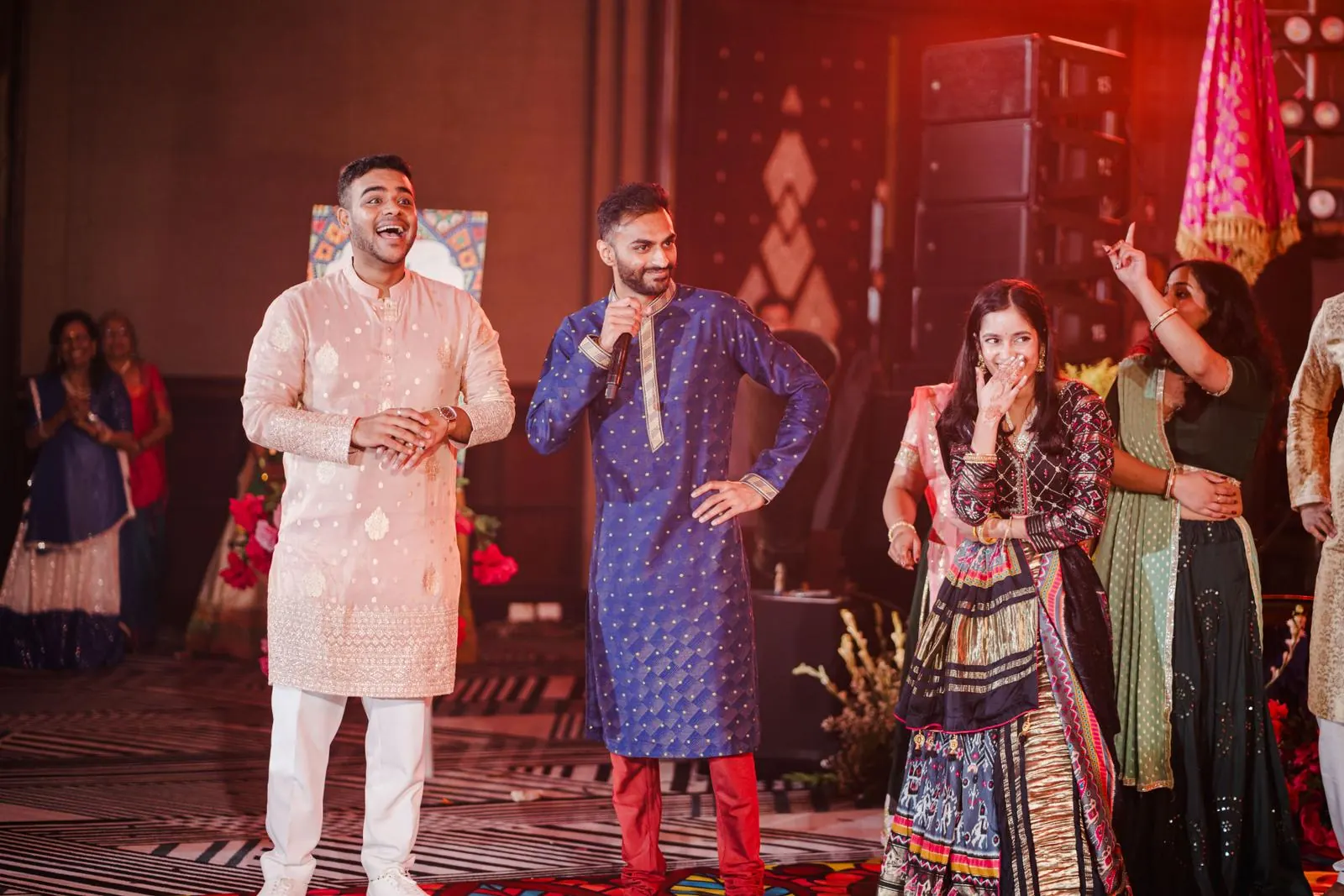 Chirag Vithalani on stage with the couple at Jenny and Mihir's sangeet in Phuket
