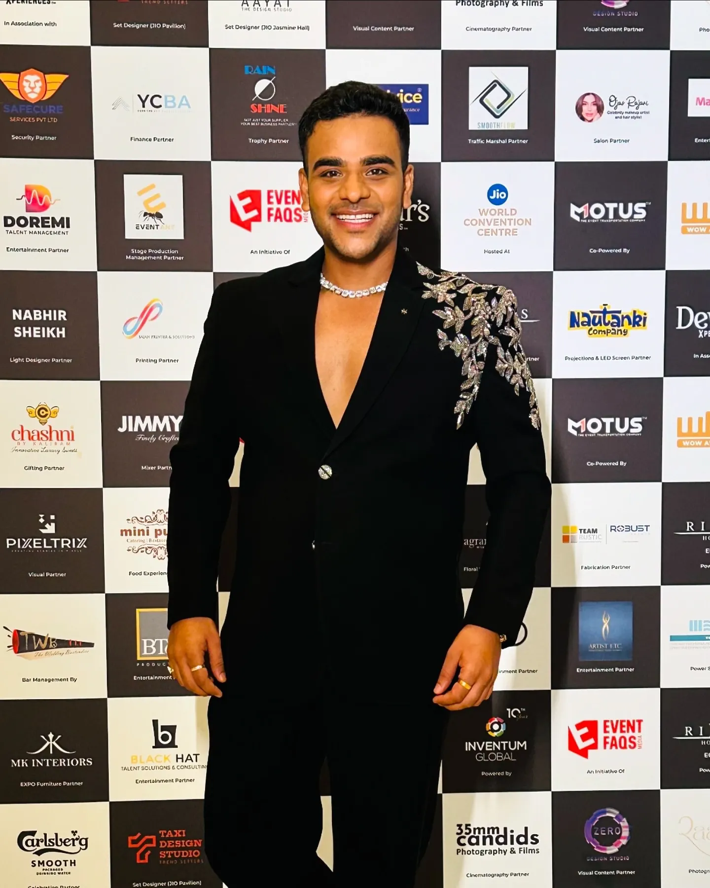 Chirag Vithalani on a red carpet in a black embellished jacket